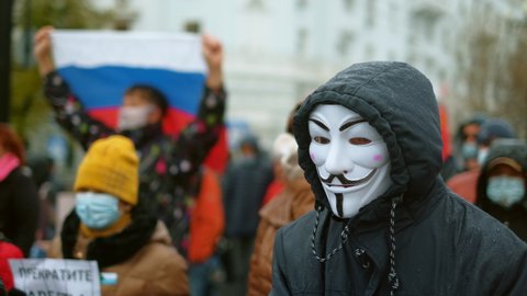 Russia, Khabarovsk, 24.10.2020: Anonymous masked protester. Peaceful people political demonstration, opposition guys rally. Striking protesting city riot. City protest. Non violent march