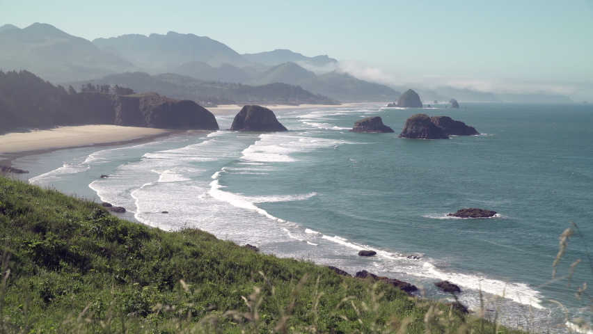 Cannon Beach Oregon High Angle 4K UHD. Cannon Beach from Ecola State Park, Oregon, United States. 4K UHD.
 Royalty-Free Stock Footage #1073098448