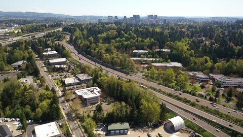 Cinematic 4K aerial drone shot of the freeway exchange at Lakeview, Central Houghton, Yarrow Bay, residential neighborhoods near Bellevue and Seattle, King County, Washington