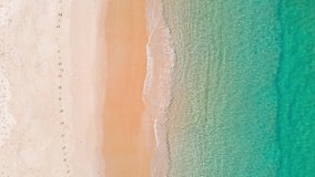 Professional Video. Aerial view drone over beach sea. Beautiful sea waves. Beach sand and sea. Summer sunset seascape. Phuket Thailand Beach. Water texture. Top view of the fantastic natural sunset.