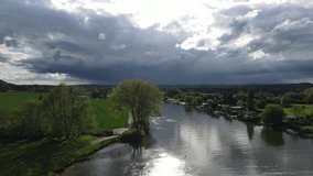 River Thames at Bourne End sun shining off water UK Buckinghamshire Aerial footage