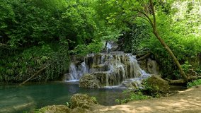 Video with a beautiful waterfall in green spring forest, Krushuna falls, Balkan Mountains, Bulgaria