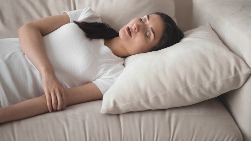 Woman tired sleep sofa home alone relax | Shutterstock HD Video #1073136731