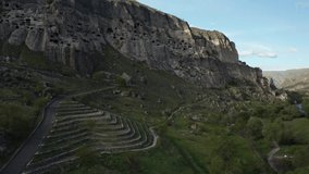 The cave city of Vardzia in Georgia filmed from a drone