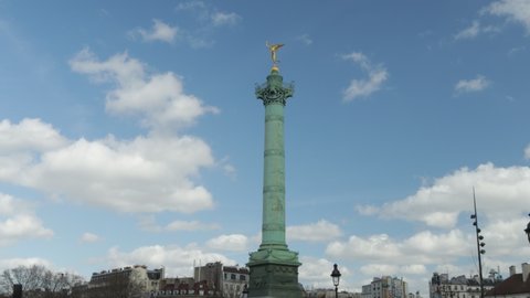 July Column at Bastille in Paris timelapse during sunny day with clouds, symbol of the french revolution