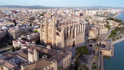 Aerial circling shot of Cathedral of St. Mary of Palma, Spain