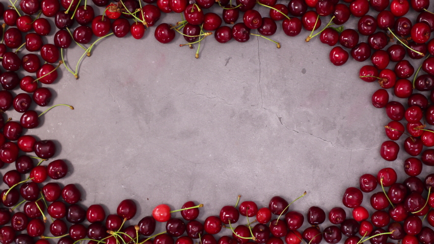 6k Group of cherries make frame for text. Stop motion Royalty-Free Stock Footage #1073140262