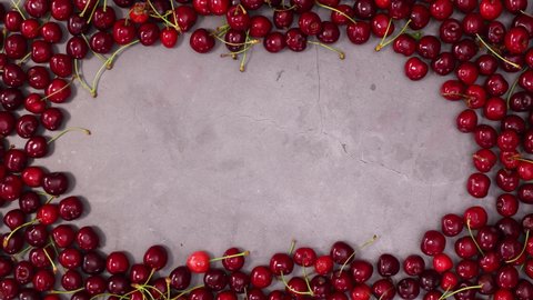 6k Group of cherries make frame for text. Stop motion