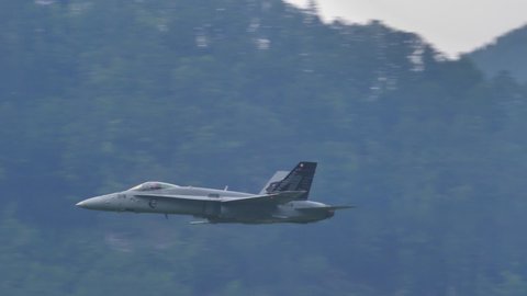 Mollis Air Show Switzerland AUGUST, 16, 2019. Supersonic military airplane in slow motion. McDonnell Douglas F-18 Hornet, Boeing, of Swiss Air Force