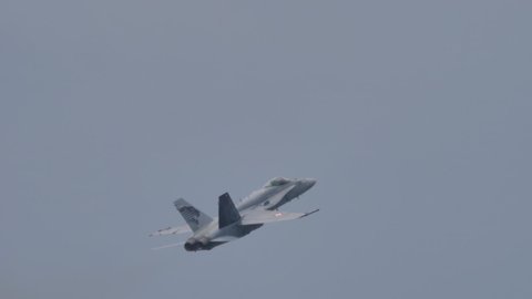 Mollis Air Show Switzerland AUGUST, 16, 2019. Grey NATO modern fighter plane in slow motion. McDonnell Douglas F-18 Hornet, Boeing, of Swiss Air Force