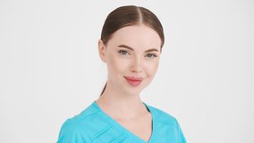 Doctor woman studio professional nurse happy teeth smile ower white background looking camera in blue uniforme medical