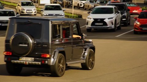 Kiev, Ukraine - May 22, 2021: Two powerful cars Mercedes G class and Audi RS7 are driving in the city. Mercedes and Audi in motion
