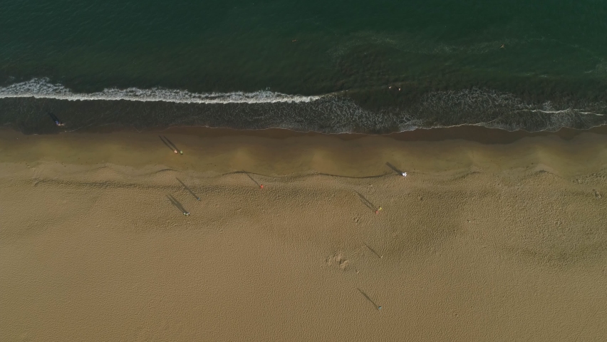 Quy Nhon beautiful beach and some peple walking in the morning in the Quy Nhon City, Viet Nam.