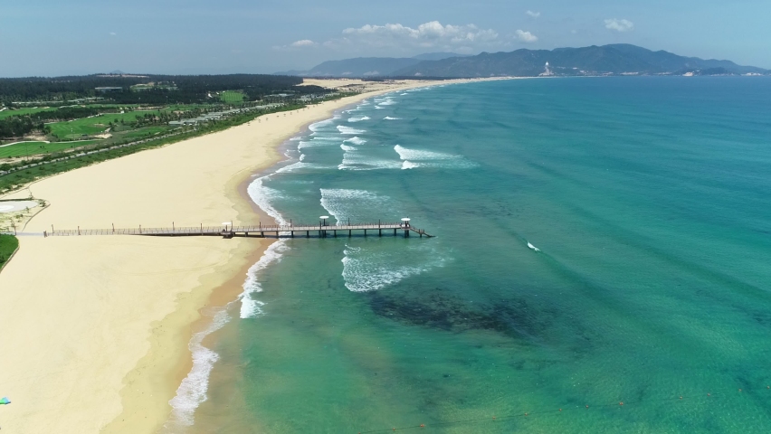 Quy Nhon beautiful beach and some peple walking in the morning in the Quy Nhon City, Viet Nam.