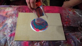 Time lapse of dirty cup fluid art pouring bright colored acrylic paints on white paint puddle at canvas. C Process of drawing, making abstract liquid acrylic painting in workshop.  - Powered by Shutterstock - Get 15% off with code: PIKWIZARD15