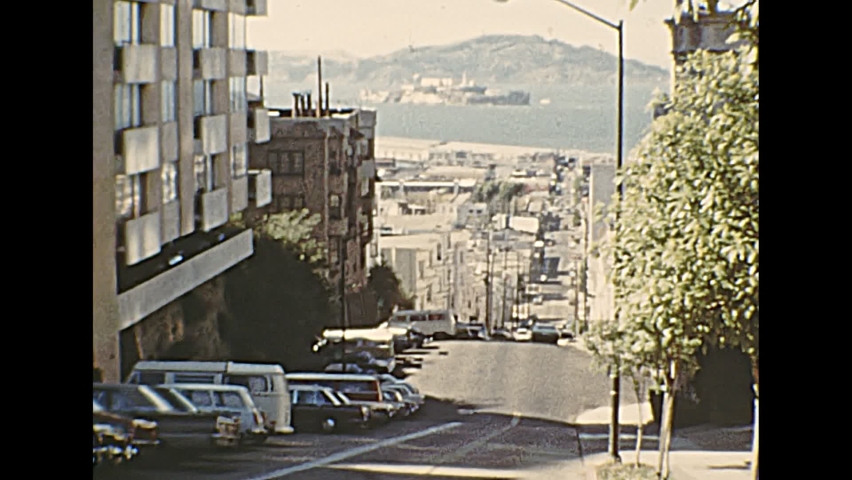 1970s archival of Alcatraz island in San Francisco Bay skyline, top of Taylor St view of Fisherman