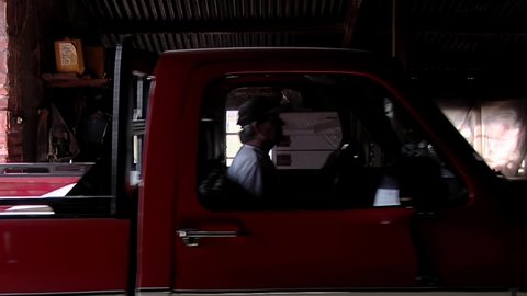 Entre Rios, Argentina - March 2020: Worker arriving in Old Pick Up Truck to the Poultry Farm Shed.