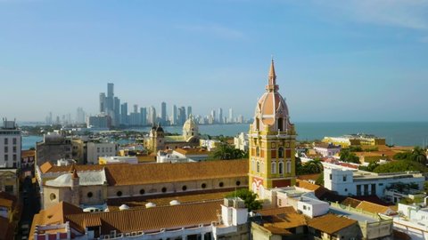 Beautiful Cinematic Shot of the Walled Old City of Cartagena, Colombia. Located on the Caribbean Coast, this city has both colorful historic buildings and spectacular modern skyscrapers