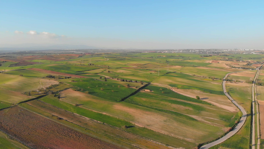 Aerial shot of a farm in a beautiful countryside on a sunny day