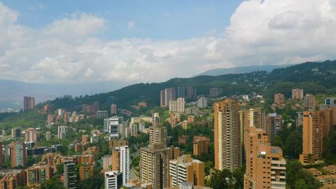 Luxury Apartment Buildings Revealed in Wealthy Medellin Neighborhood. Aerial Pedestal Down.