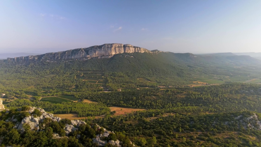 Aerial shots of the Castle of Montferrand (12th century) at the top of the mountain. We can see the Pic Saint Loup, the Hortus and the village of Saint Mathieu de Treviers in the southeast of France. Royalty-Free Stock Footage #1073188016