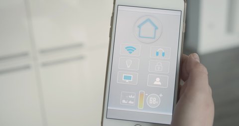 Intuitive smart home app operated on smartphone screen. Control over temperature, light, security systems and the entertainment system by touch.