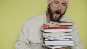 Bearded man in pink hat with brain pattern yawning tired and start to sleep on a stack of books. Education challenge. Preparation for exams process. Researcher falls asleep at work. Reading routine  - Powered by Shutterstock - Get 15% off with code: PIKWIZARD15