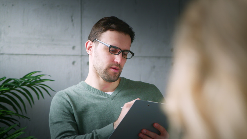 Young psychotherapist providing psychological assistance to a young girl. A young girl who seeks a specialist