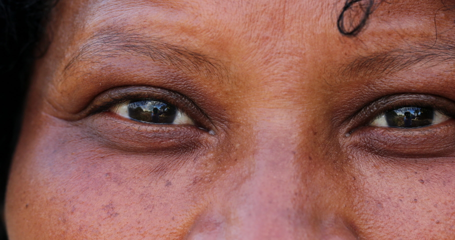African woman eyes, mature black person macro close-up. | Shutterstock HD Video #1073216402