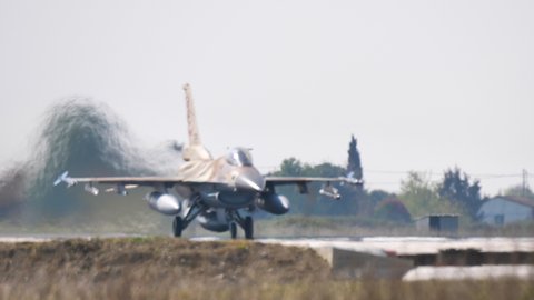 Andravida Greece APRIL, 03, 2019 Armed combat jet plane takes off with full afterburner power. Lockheed Martin F-16C Barak or Fighting Falcon or Viper of Israeli Air Force IAF