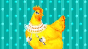 Yellow chicken with a knife and fork in the style of pop art jumps in the video