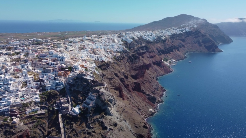Flying towards white houses of Santorini, Greece. | Shutterstock HD Video #1073245463