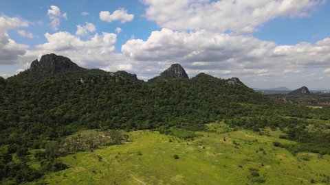An Aerial Drone Footage of Hillside with trees and rocks in Lopburi Province, Thailand.