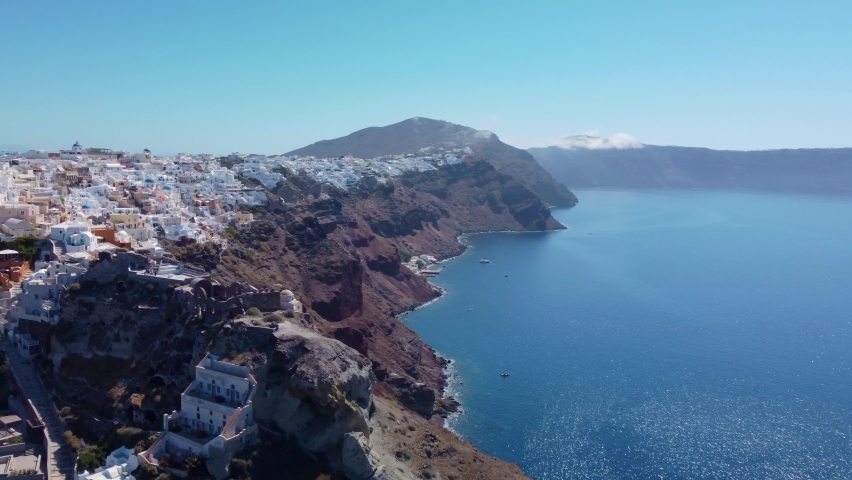 Aerial view flying over city of Oia on Santorini Greece