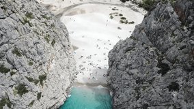 Aerial footage of Torrent De Pareis. A beautiful beach between to cliffs in Majorca, Spain
