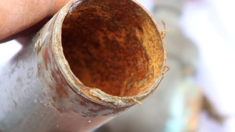 Red rust on the inside old pipe surface
