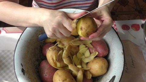 the cook peels the potatoes.  healthy food concept.  Cooking