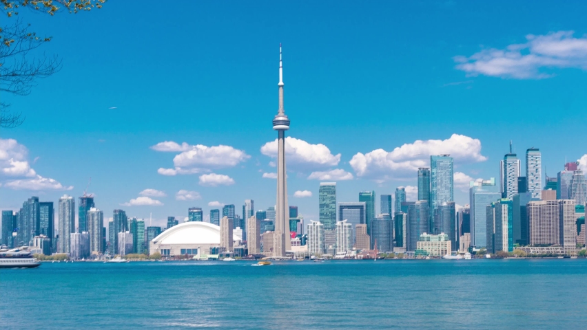 4K timelapse of daytime view of Toronto skyline and Lake Ontario during spring summer as seen from Toronto island,Toronto, Ontario Canada