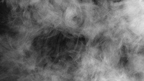 Shroud of White Smoke on Black. White smoke hangs floridly in the air and slowly spreads across the black screen
