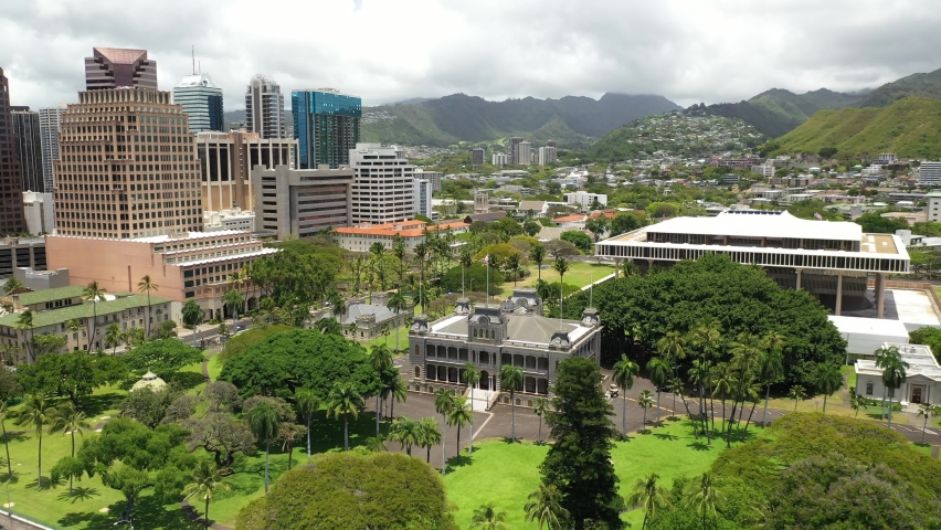 Cinematic 4K aerial drone footage of the Iolani Palace, royal residence of the monarchs with downtown Honolulu, Oahu, a Polynesian, Pacific Island tourist destination in Hawaii