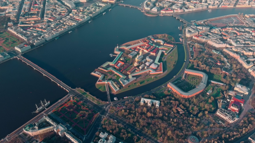 The morning flight over the sights of St. Petersburg and the water area of the Neva river, Peter and Paul fortress, Rostral columns, bridges, St. Isaac cathedral, the Admiralty