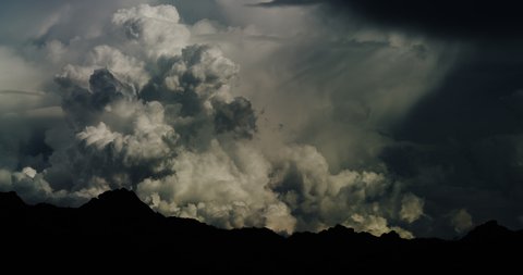 Billowing cloudscape and developing desert monsoon storm event over a Arizona mountain range