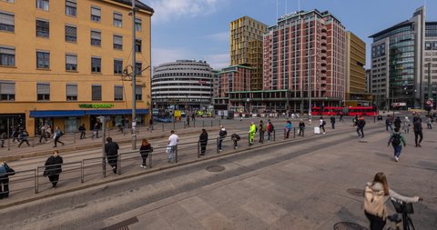 Oslo, Norway - April 24 2019: Time Lapse of the Jernbane Torget close to the main railway station in central Oslo