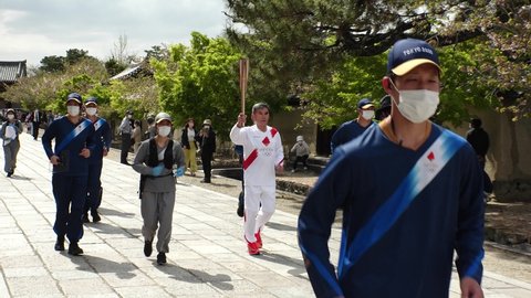 NARA, JAPAN - 12 APRIL 2021 : Tokyo 2020 Olympic Torch Relay at Nara Horyuji temple.