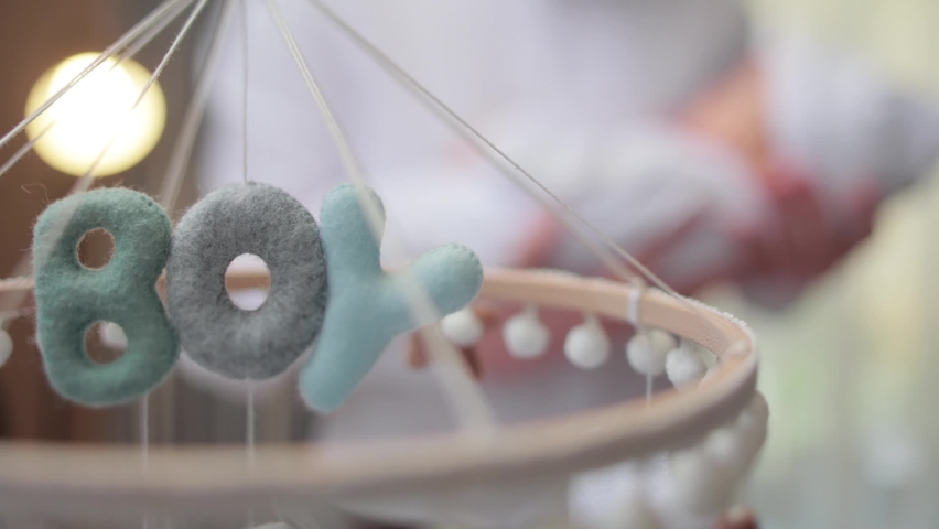 textile soft toys rotate over the baby