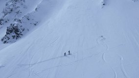 Aerial view of snow mountain range landscape in Slovakia. 4k winter drone footage.  Rocks ridges landscape drone aerial flight in mountains nature landscape.
