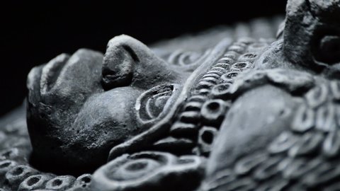 Stone sculpture of face of ancient art south american aztec, inca, olmeca