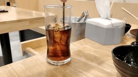 Cola in a glass. Food video. 