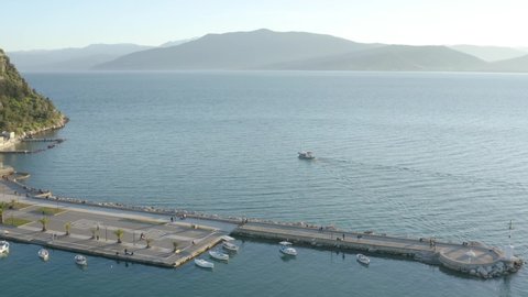 Beautiful Nafplio port in Greece, slow aerial push on calm Summer day