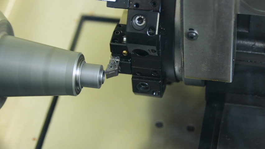 Cutting tool processing steel metal detail on cnc lathe machine | Shutterstock HD Video #1073328971